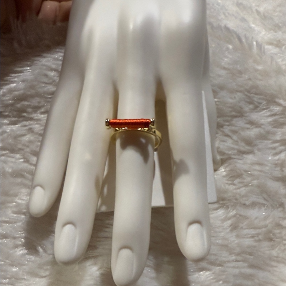 French Connection Gold Ring with Red Accent